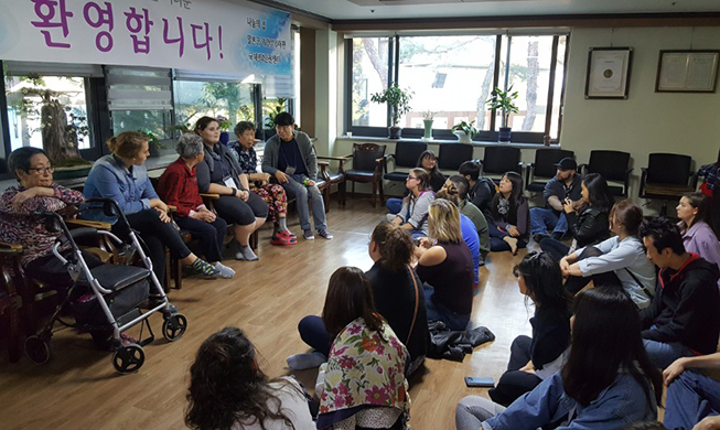 Sexual slavery victims speak to non-Koreans at House of Sharing